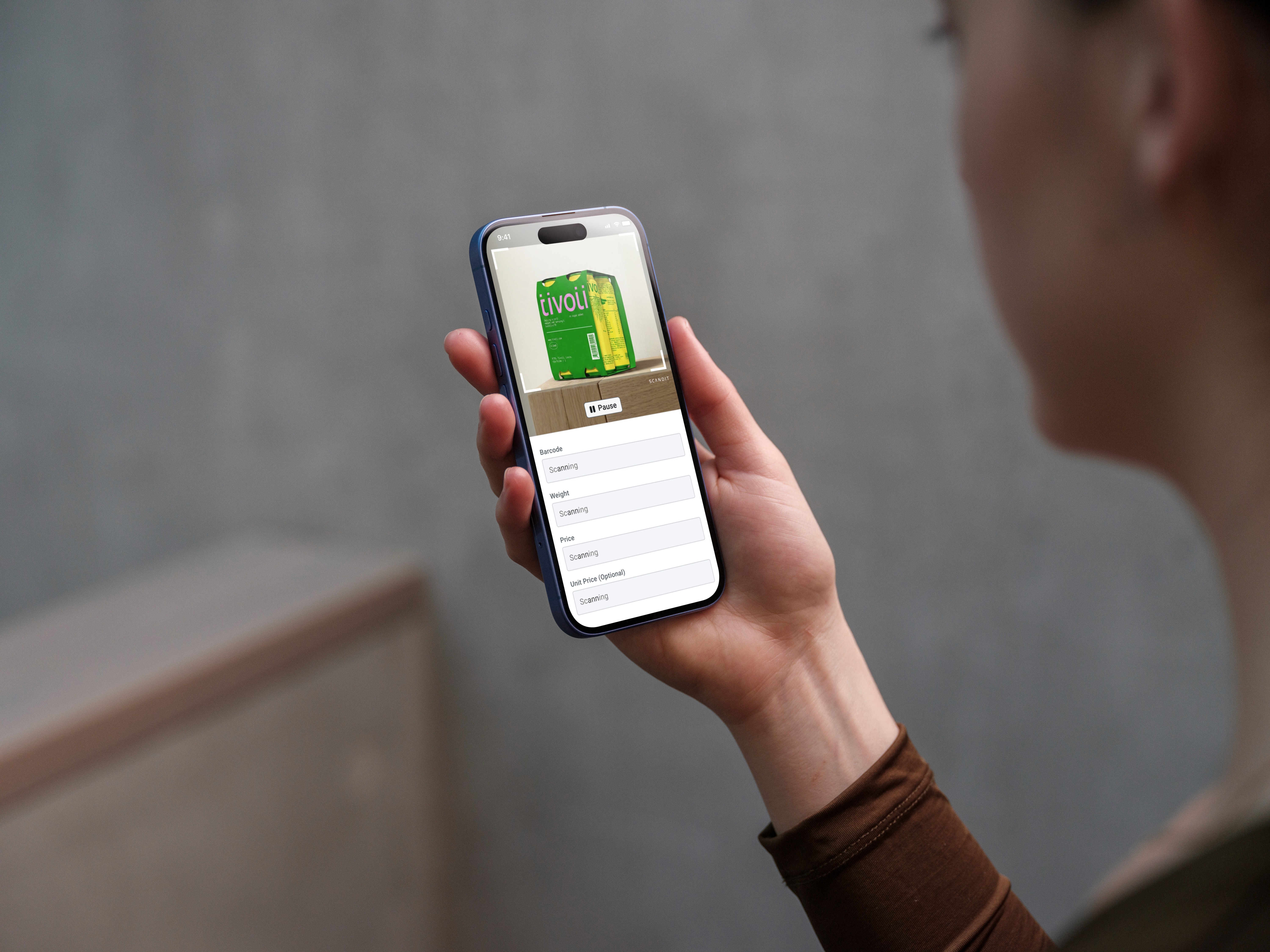 A person scans a product label with Smart Label Capture, with captured fields shown below the camera preview.